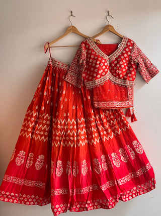 Orange Net Mirror and Sequin Embellished Lehenga Choli