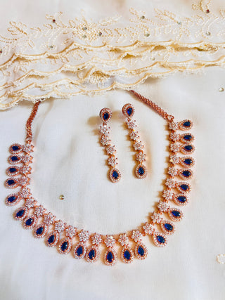 Delicate AD set with Blue crystals in Gold Finish