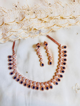 Delicate AD set with Blue crystals in Gold Finish
