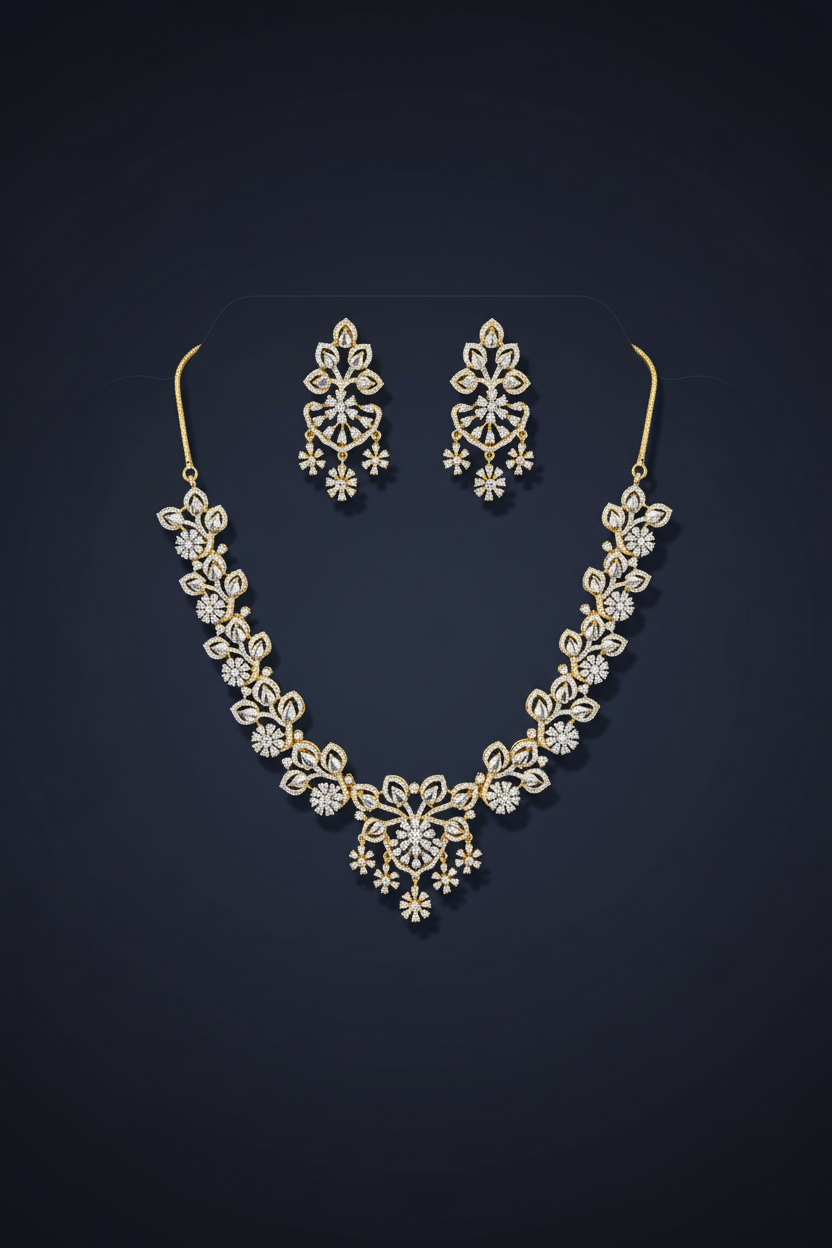 Trisha Necklace Set, gold-tone floral crystal necklace and matching chandelier earrings on a dark blue studio background