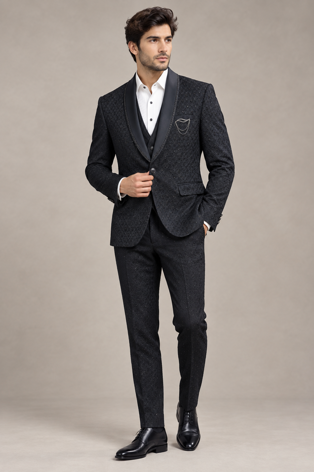 Three-quarter view of dark patterned shawl-lapel jacket and waistcoat over white dress shirt