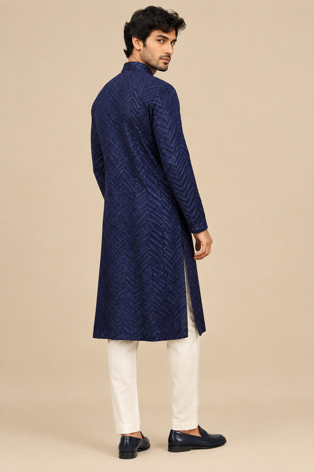 Single full-length back three-quarter view of navy chevron-patterned kurta on model