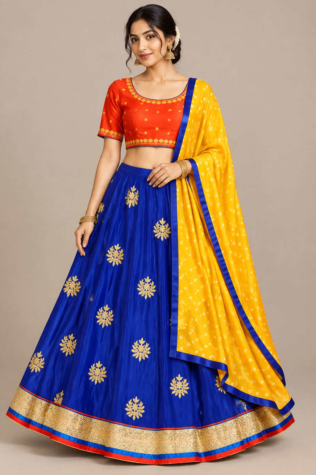 Three-quarter view of model wearing blue lehenga with gold border and yellow drape