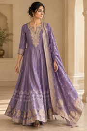 Walking pose in dusty lavender embroidered gown with matching bordered dupatta