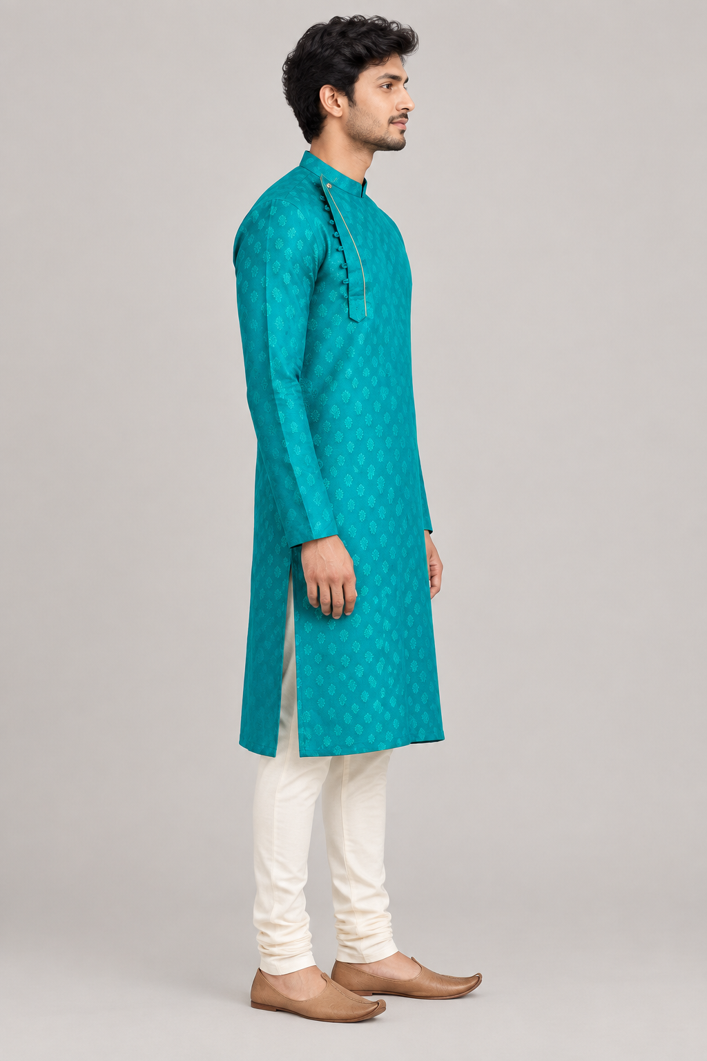Male model in teal buti pattern kurta, side view