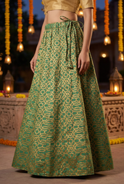 Green and gold skirt showing adjustable side drawstring waist and full lower skirt.