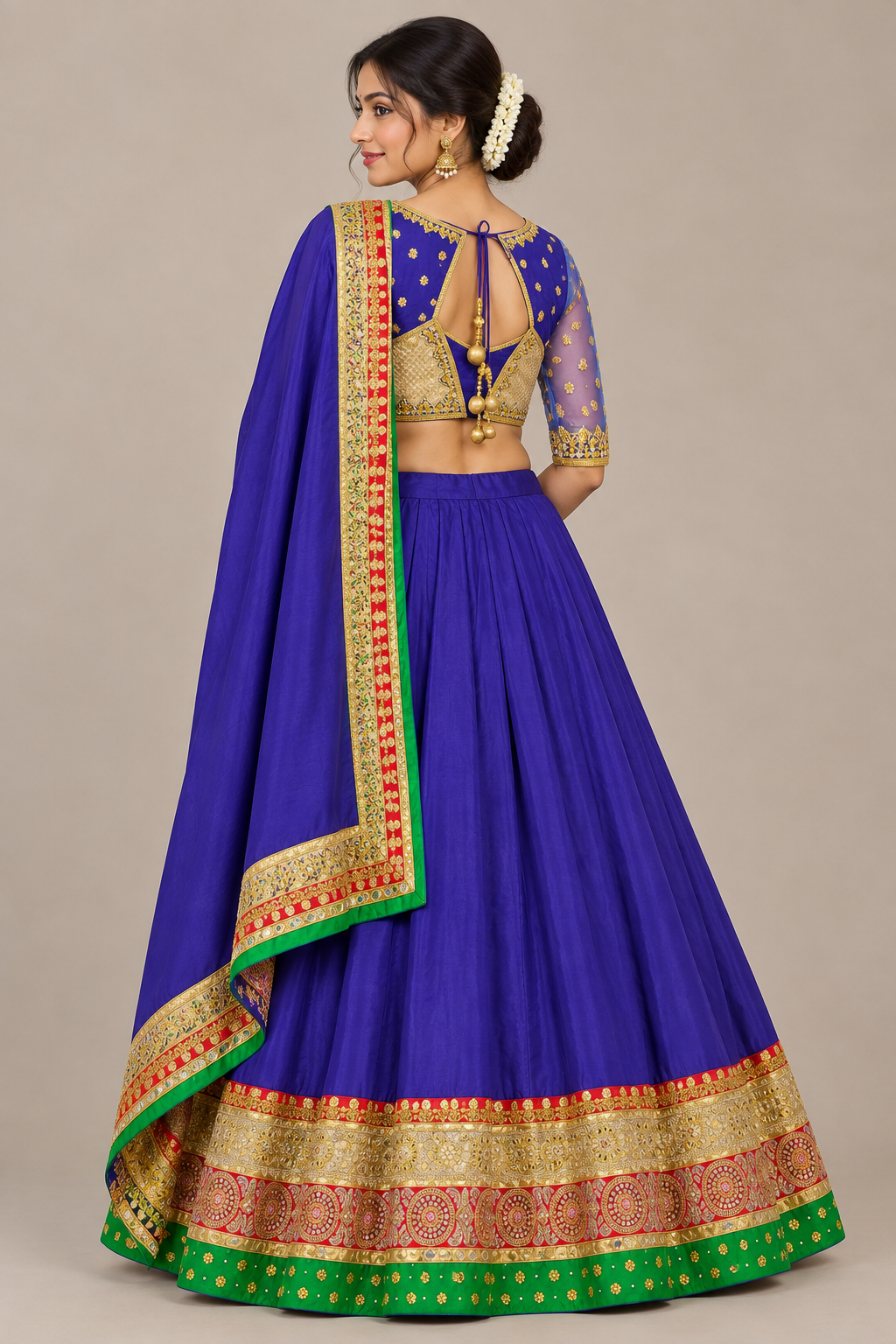 Rear view of purple lehenga showing blouse tie-back, shorter sleeves and opaque bordered dupatta