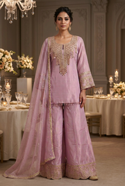 Front view of lilac gold sharara set with sheer dupatta at an elegant evening reception
