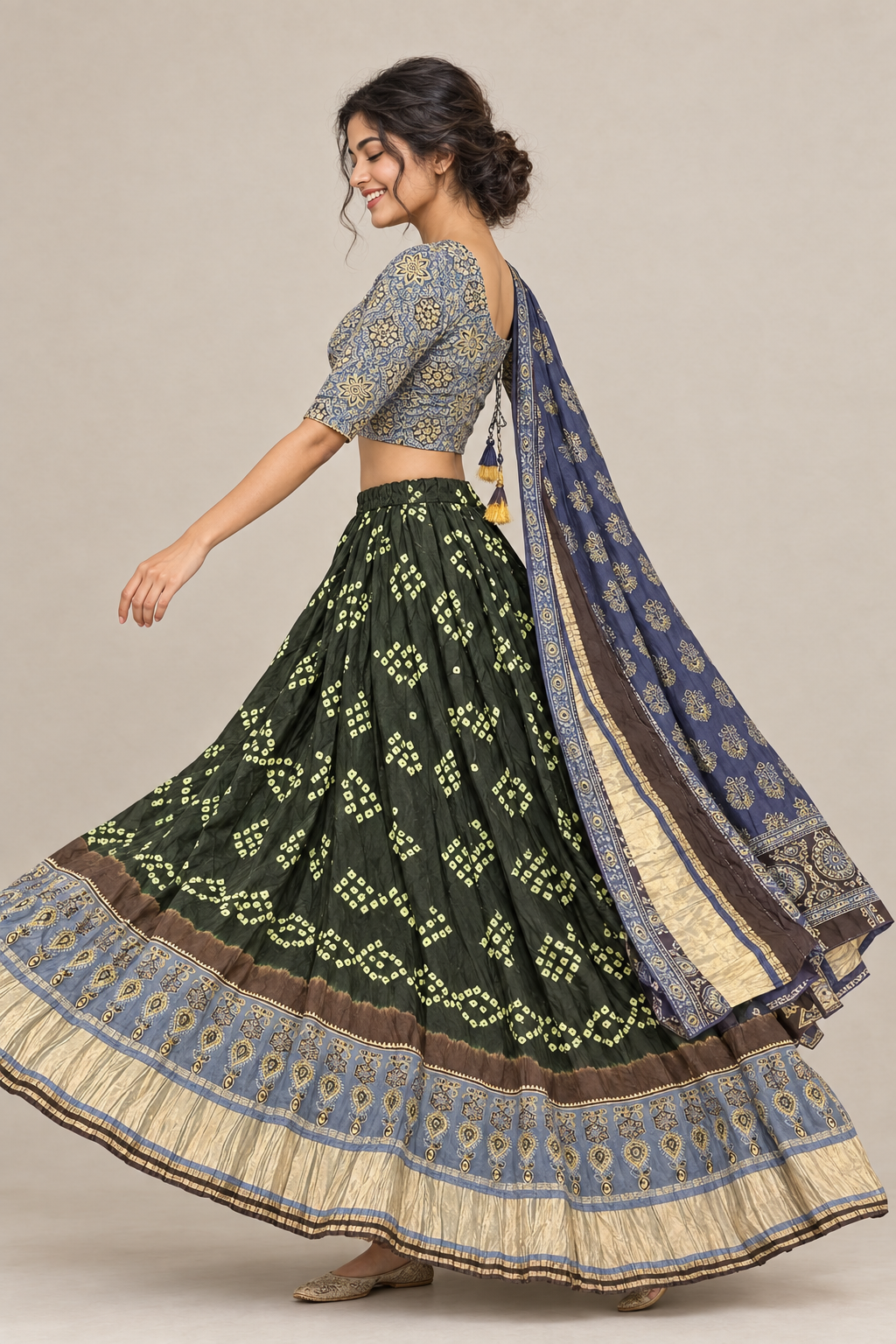 Side view of female model in green Garba lehenga with patterned border and navy dupatta