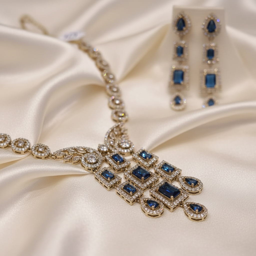 Close detail of the cascading blue stone pendant and matching drop earring