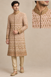 Model in blush and gold floral sherwani, front three-quarter view with collar inset