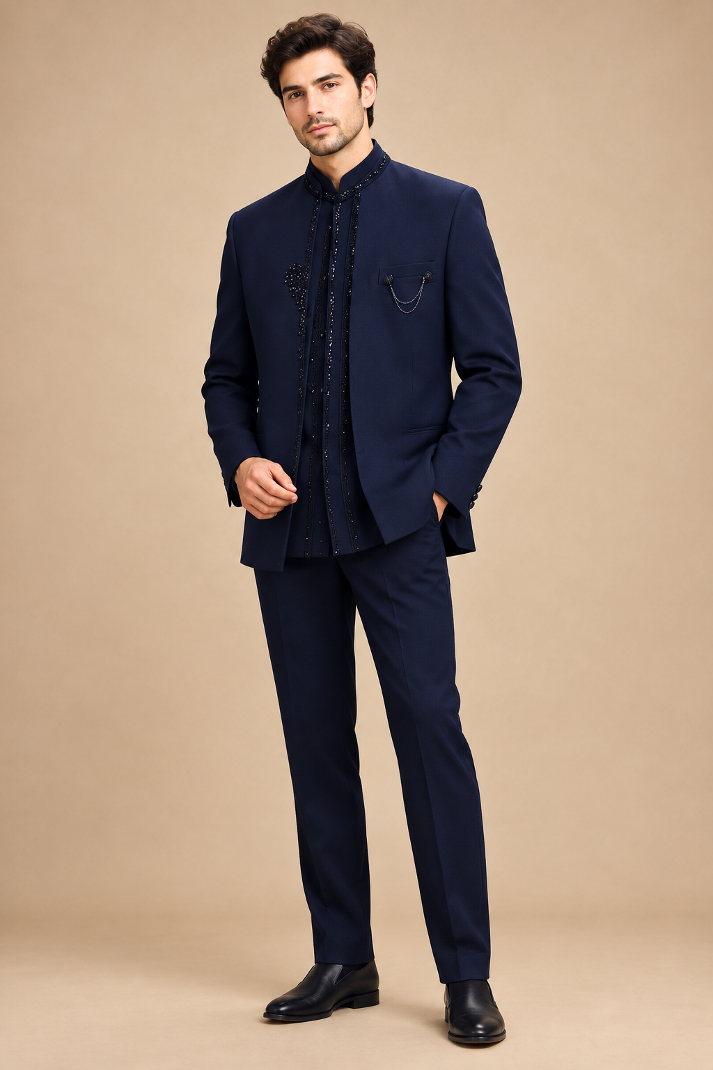 Male model in navy bandhgala jacket, dark inner layer and matching trousers, front three-quarter view