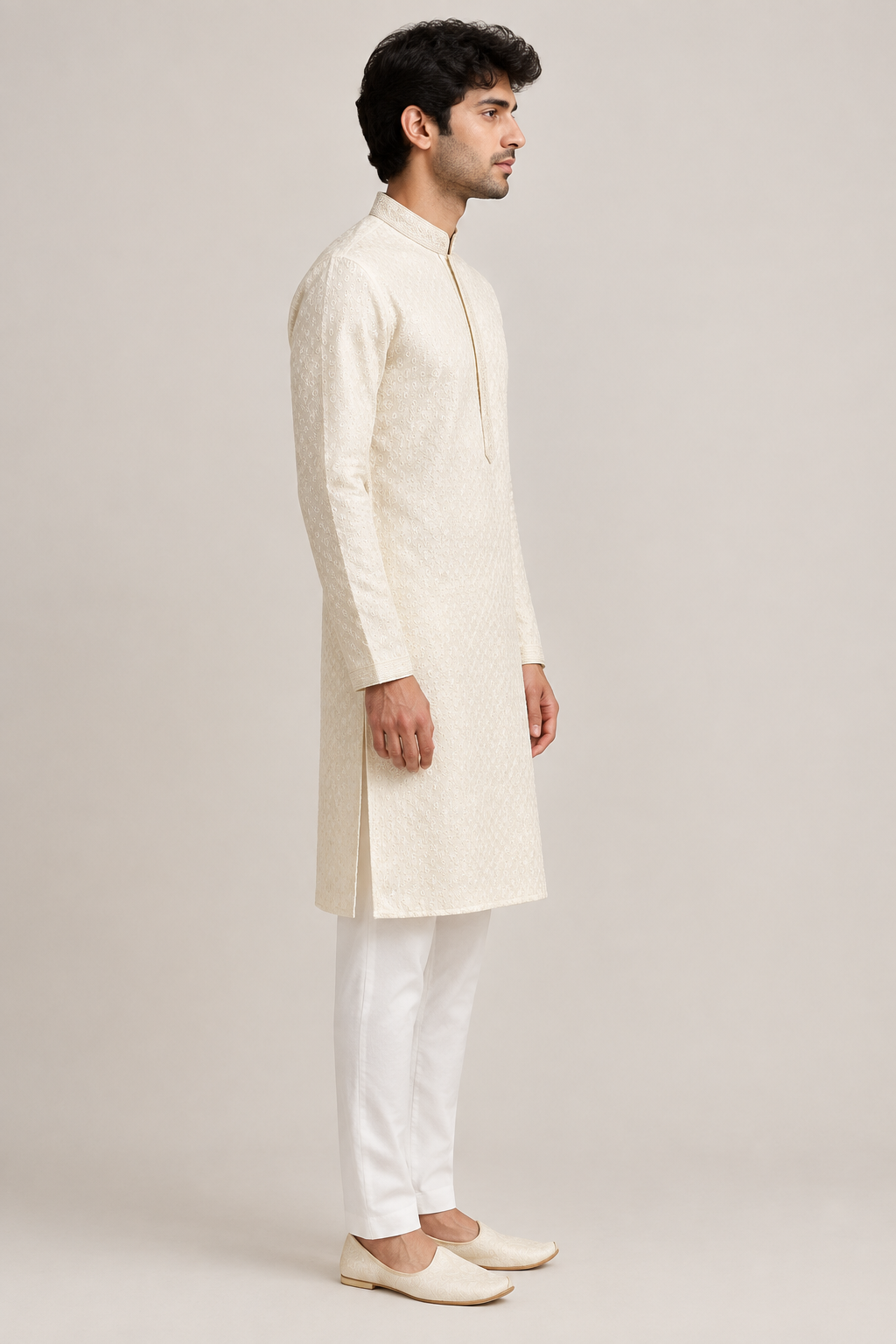 Male model wearing the ivory textured kurta with a stand collar, side profile view