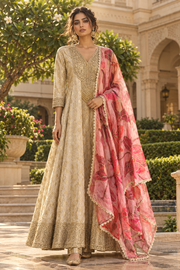 Model in beige brocade anarkali with pink floral dupatta, front view