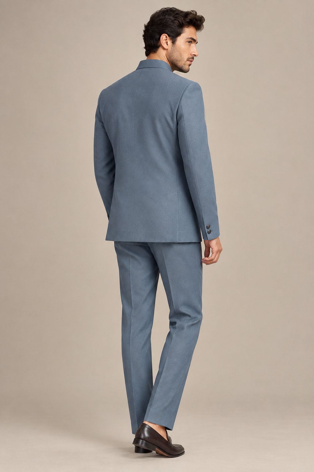 Male model in slate-blue band-collar jacket and matching trousers, rear three-quarter view