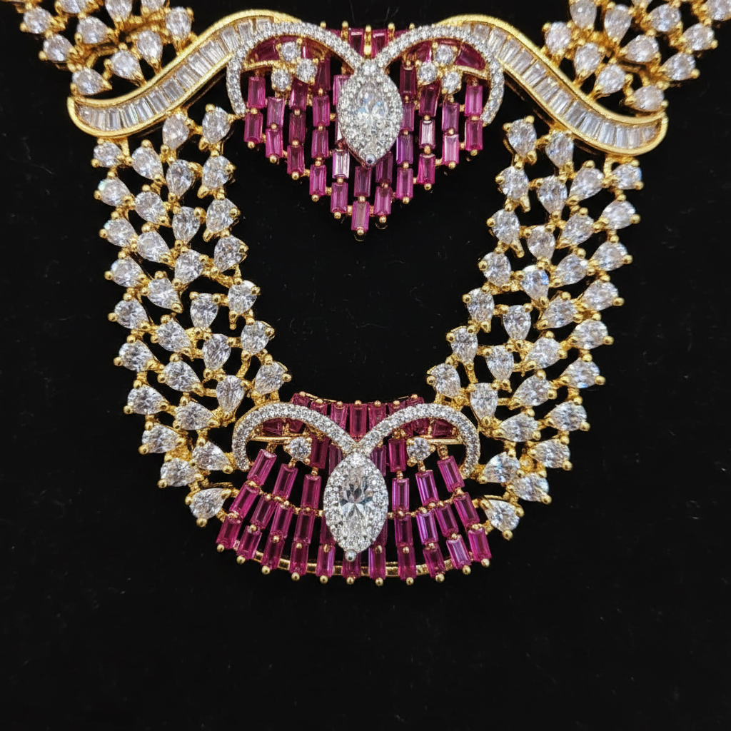 Close-up of the pink ruby-colored fan pendant on the Shreya necklace