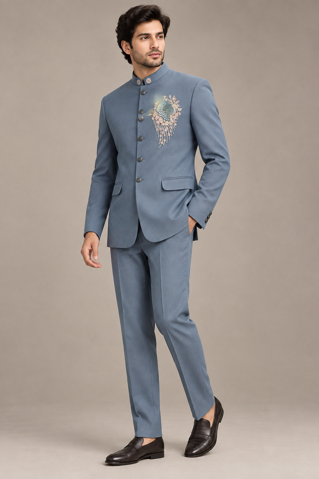 Male model in slate-blue bird-motif jacket and matching trousers, side three-quarter view