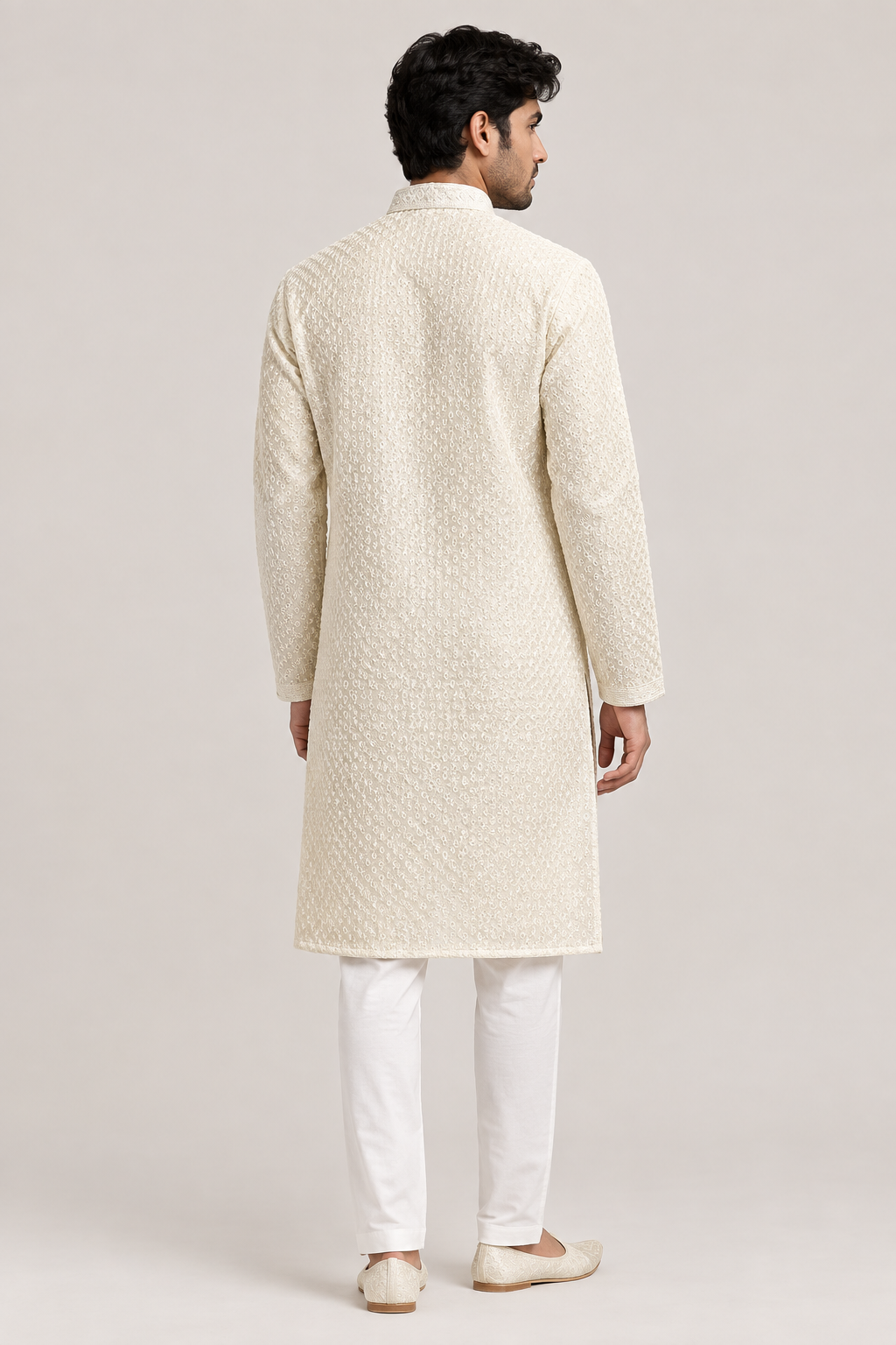 Male model wearing the ivory textured kurta, rear three-quarter view showing the back of the stand collar