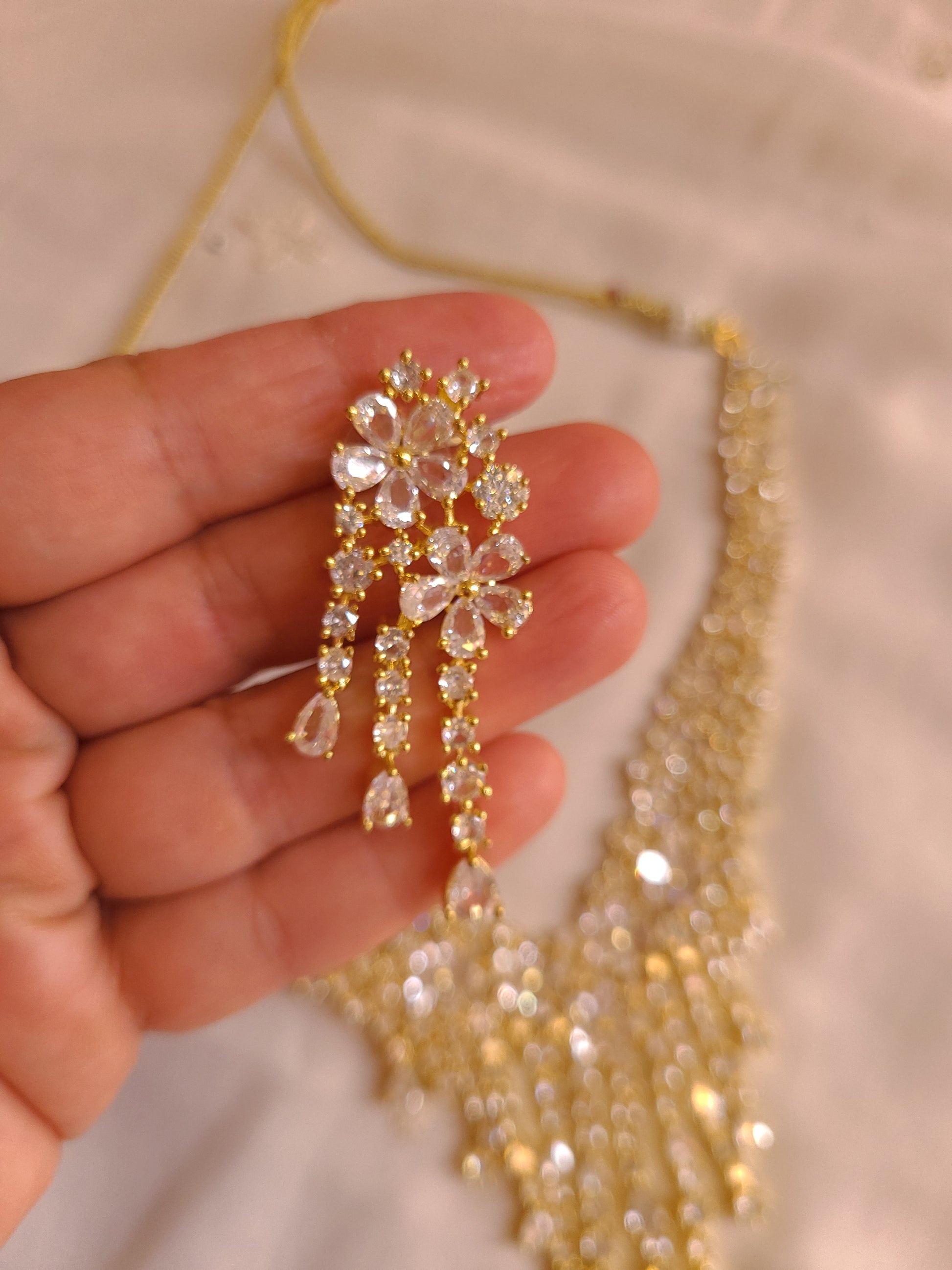 MOHAR statement floral crystal and cubic zirconia necklace set in gold-finish setting