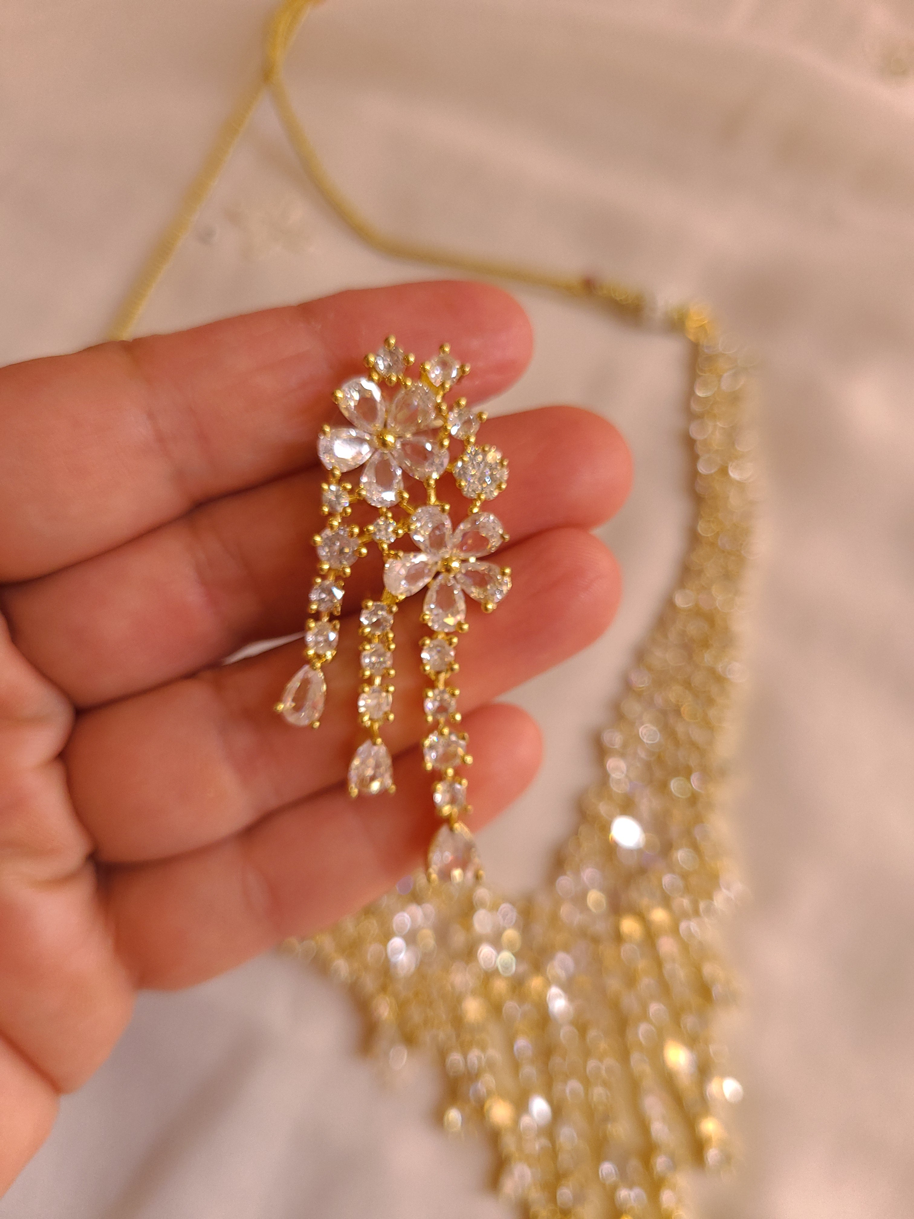 MOHAR statement floral crystal and cubic zirconia necklace set in gold-finish setting