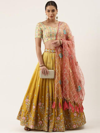 mustard yellow silk sequin and thread embroidered Lehenga choli and pink dupatta