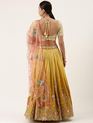 mustard yellow silk sequin and thread embroidered Lehenga choli and pink dupatta