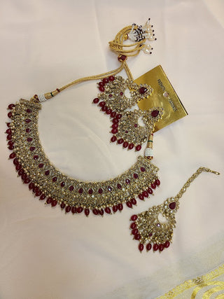 Ruby and Champagne color crystal heavy necklace set with maang tikka
