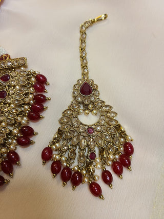 Ruby and Champagne color crystal heavy necklace set with maang tikka