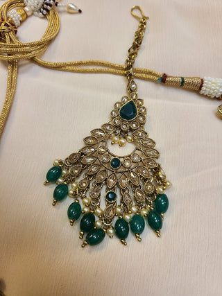 Emerald and Champagne color crystal heavy necklace set with maang tikka