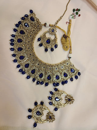 Blue sapphire and Champagne color crystal heavy necklace set with maang tikka