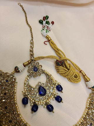 Blue sapphire and Champagne color crystal heavy necklace set with maang tikka