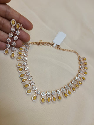 Delicate AD set with yellow crystals in Gold Finish